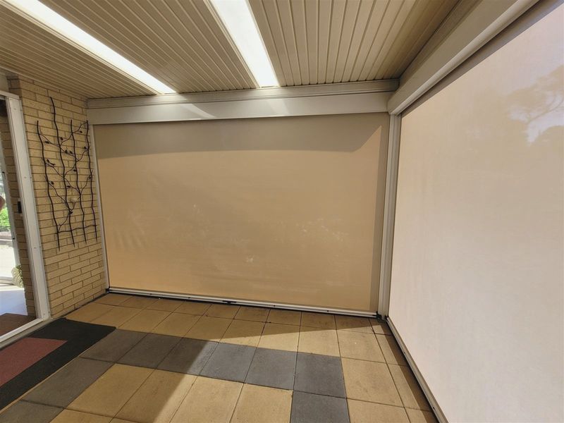 The same veranda enclosed with outdoor blinds