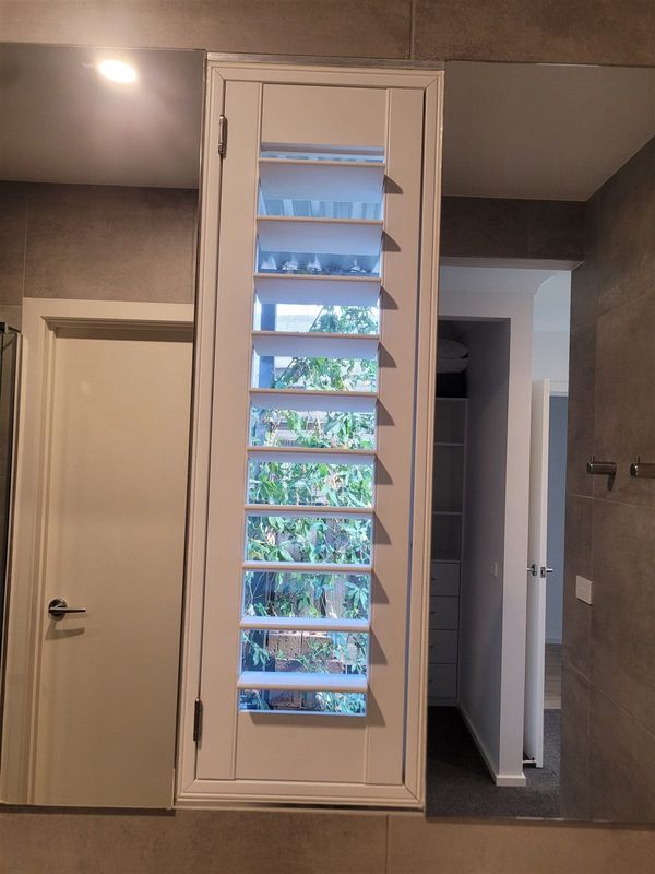 Plantation shutters on an ensuite window