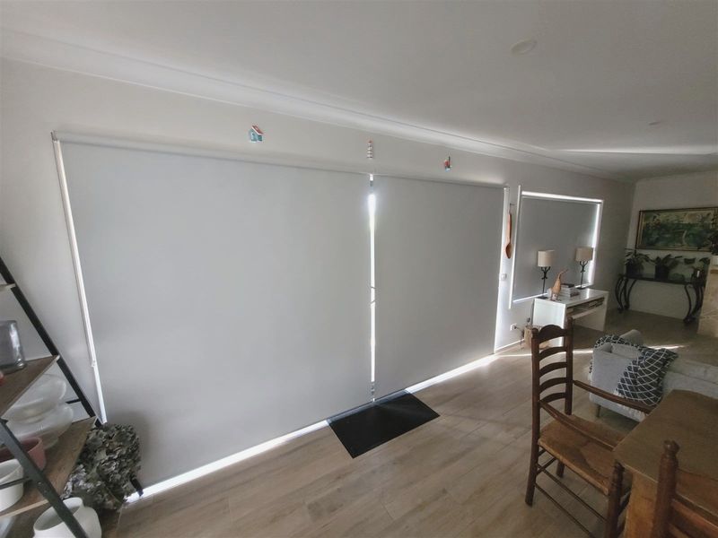 Roller blinds on dining room windows